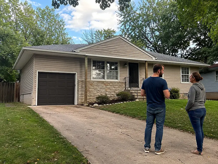 Kansas City house being evaluated by cash home buyers after a change in household income