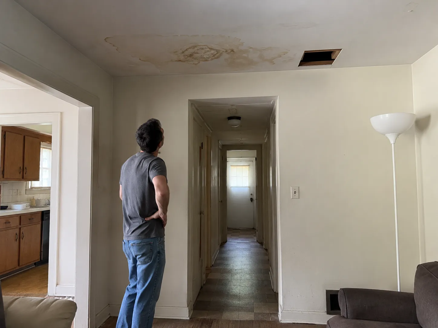 Kansas City home with exterior damage and repairs needed before selling